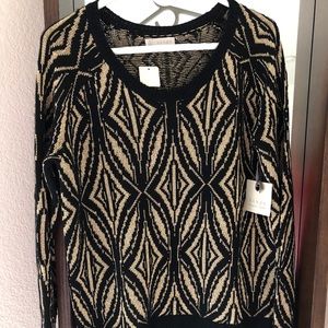 Gold and black sweater.